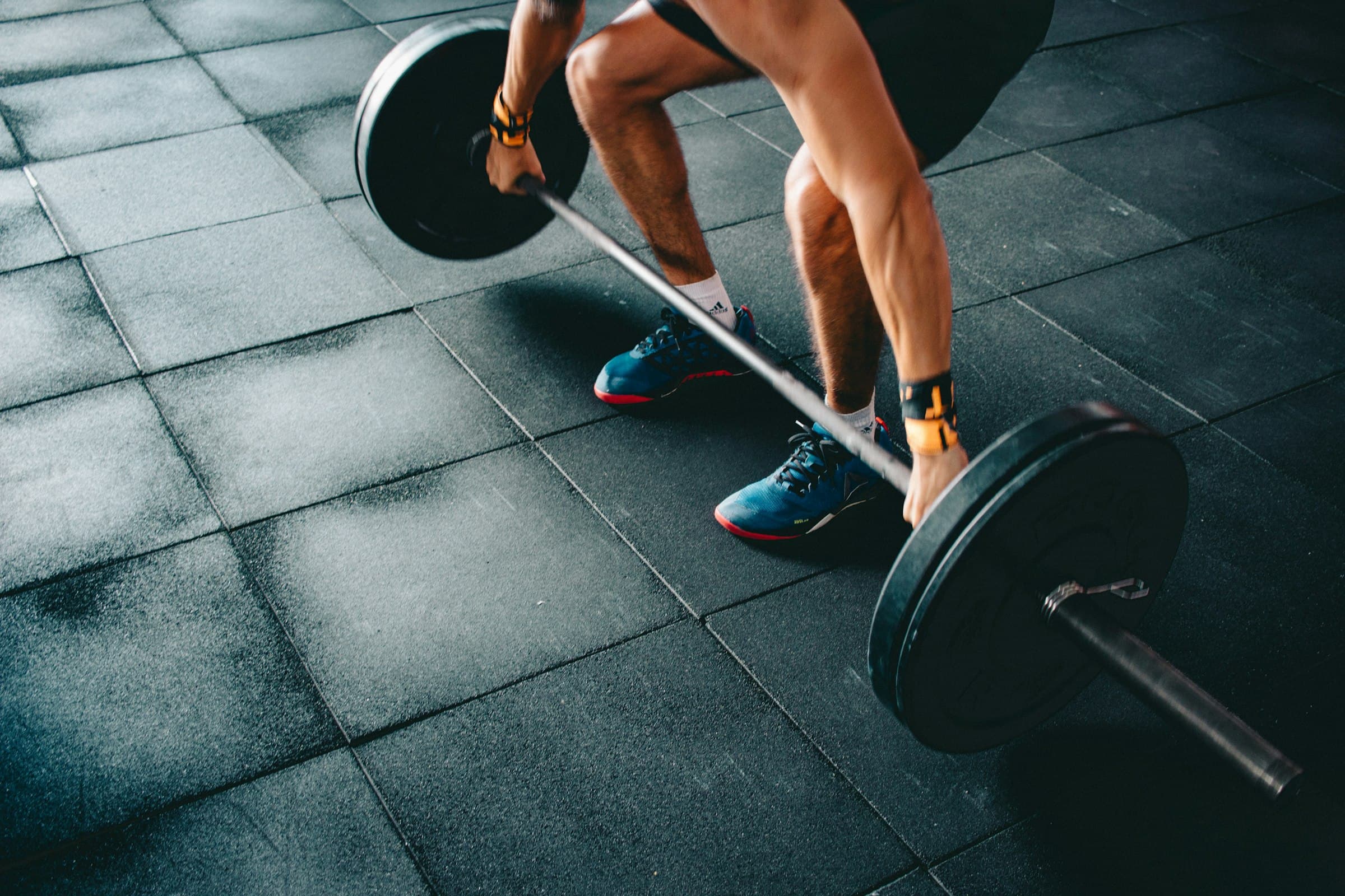 Member setting up for a deadlift on the Nexus Athletica floor